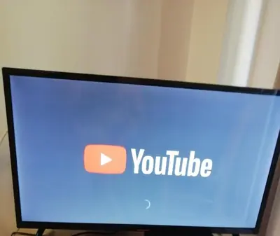 a computer monitor with the word youtube on the screen at Seaview, just across the beach, Bečići in Becici